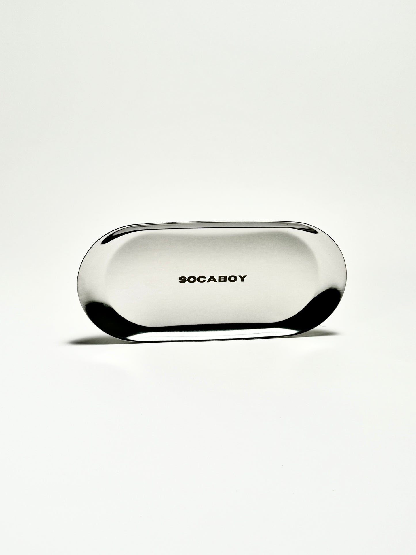 The Socaboy Rolland Tray in chrome is photographed against a white backdrop. The tray features the logo engraved in the centre.