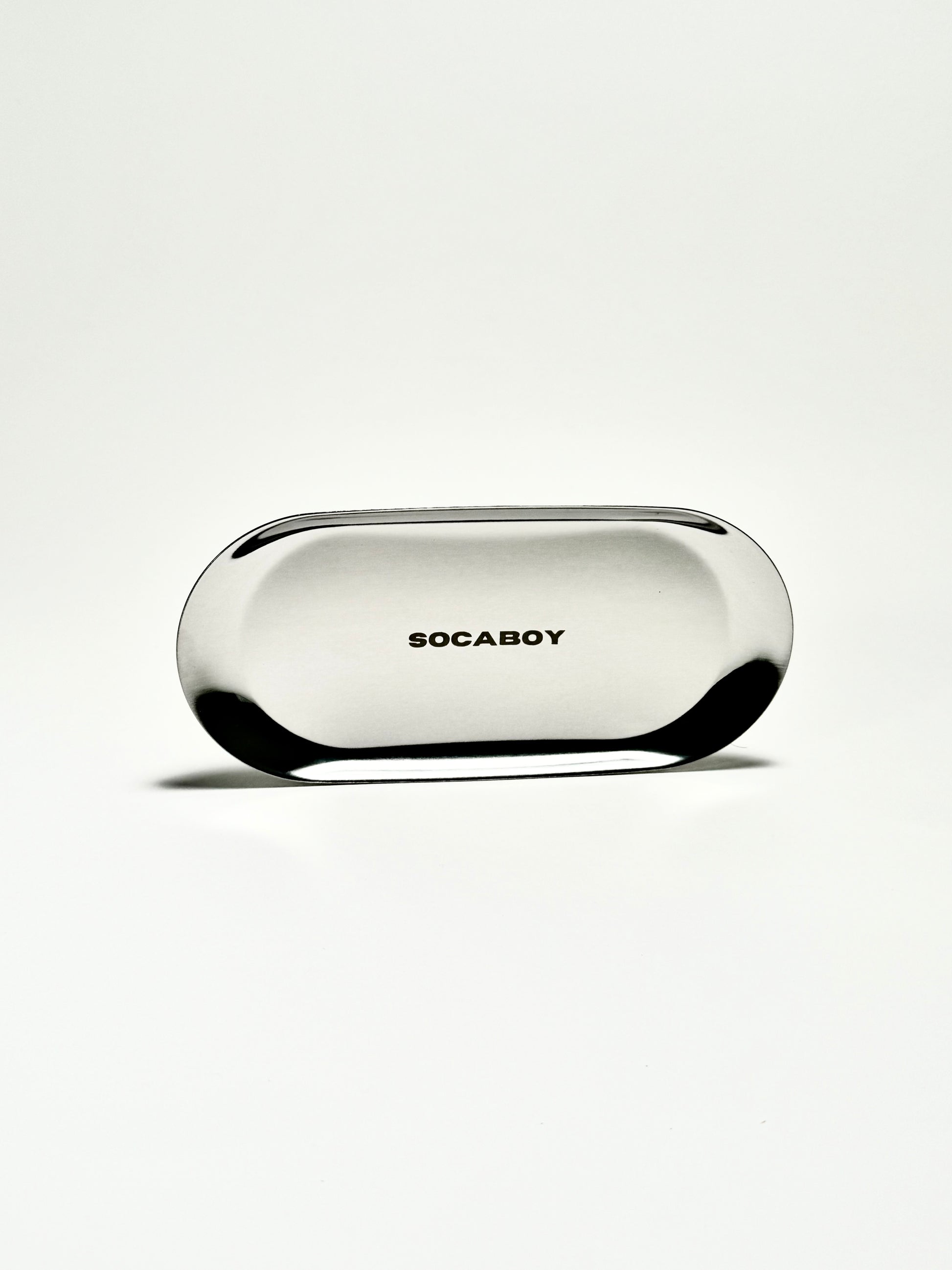 The Socaboy Rolland Tray in chrome is photographed against a white backdrop. The tray features the logo engraved in the centre.